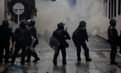 Riot police officers in the streets during demonstrations in Bogotá, Colombia, on 1 May. 