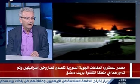 A TV grab from a broadcast by the Syrian state news agency purportedly showing the aftermath of two intercepted Israeli missiles.