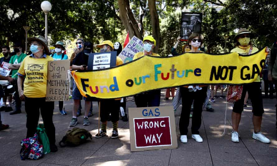 Climate activists are seen during a Cop26 protest march in Hyde Park on 6 November in Sydney