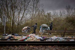 Migrants leave the Grande-Synthe camp with whatever possessions they can gather as police evict everyone living there and break up the camp in the latest attempt to disperse migrants from gathering along the French coast.