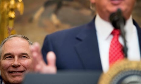 Scott Pruitt listens at left as Donald Trump speaks in the Roosevelt Room in the White House in February 2017.