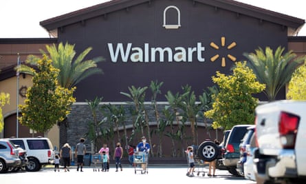 Shoppers wear face masks in the parking lot of a Walmart in Rosemead, California, this month.