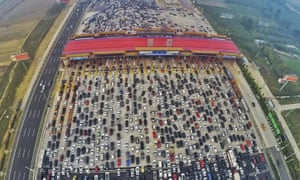 A traffic jam near a toll station in Beijing. Authorities hope t ease the burden on the city with a new metropolis 100 km away.