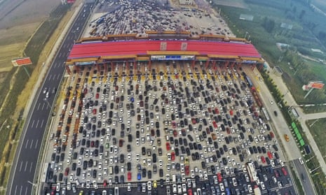 A traffic jam near a toll station in Beijing. Authorities hope t ease the burden on the city with a new metropolis 100 km away.