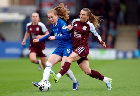 Chelsea's Sjoeke Nüsken is challenged by Aston Villa's Miri Taylor.