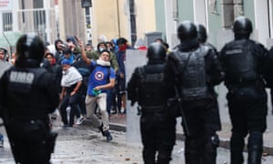 Demonstrators clash with the police in Quito, Ecuador, on Thursday.