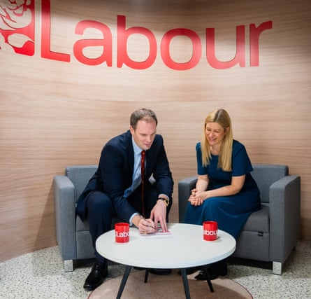 Dr Dan Poulter signing his Labour party membership form with MP Ellie Reeves, Labour’s deputy national campaign co-ordinator, on Saturday.