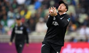 Martin Guptill of New Zealand takes a catch to dismiss Fakhar Zaman of Pakistan.