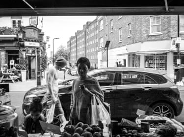 Francesco Ragazzi, Broadway MarketBetween 2015 and 2016, Ragazzi shot over fifty thousand images through the window of the grocery shop where he worked, nestled inside Broadway Market. At times, he triggered the shutter himself; at others, he left the camera to its own casuality, shooting at regular intervals, always leaning in the same position on the oil shelf. Regular loners, curious couples, neighbour families—the spectacle of Broadway Market gradually unfolds in front of the shop.
