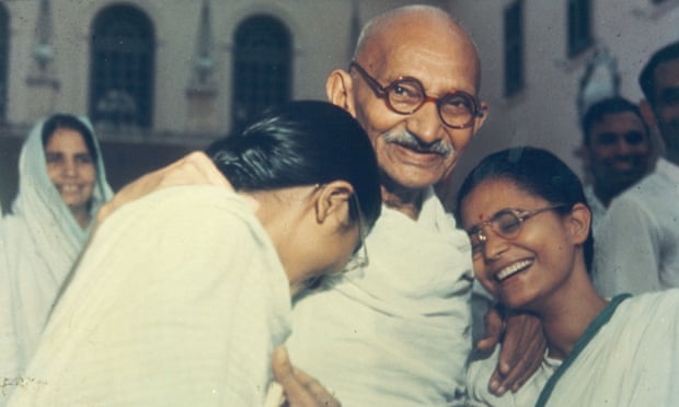 Gandhi with two of his granddaughters, Delhi, 1948.
