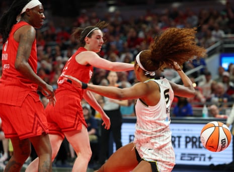 WNBA investigating claims of racist comments during Clark-Reese game | Caitlin Clark | The Guardian