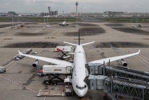 An aeroplane is loaded prior to departure from Haneda airport last week.