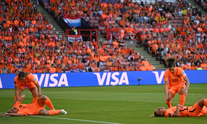 Stefanie van der Gragt (L) and Netherlands’ defender Lynn Wilms (R) both lie injured after a collision