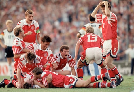 Kim Vilfort of Denmark is mobbed by teammates after scoring the second goal in their Euro 92 final win over Germany.