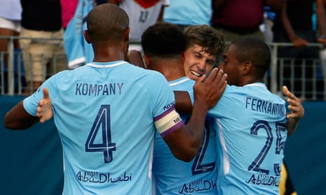John Stones is congratulated by Vincent Kompany, Kyle Walker and Danilo after his opening goal against Tottenham.