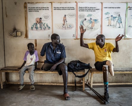 Patients with limb loss sit and talk after being attended by specialists at an International Committee of the Red Cross (ICRC)-supported rehabilitation centre in Juba in February.