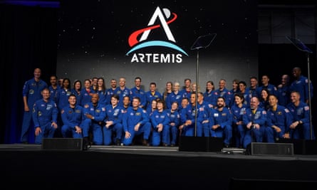 Artemis team members pose for a photo during NASA’s announcement of the Artemis II crew.
