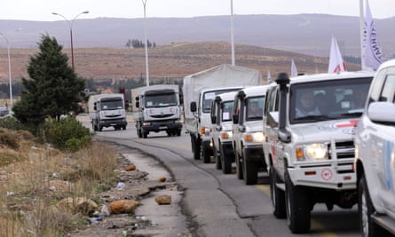 Vehicles carrying food, medicine and blankets, leave the Syrian capital Damascus as they head to the besieged town of Madaya