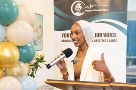 a woman speaks into a microphone
