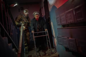 An elderly woman is evacuated from Kherson, Ukraine