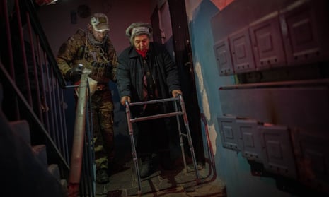Elderly residents are evacuated from Kherson on Sunday.