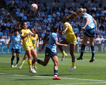 Rebecca Knaak scores City’s third goal in their final WSL game of the season with a towering header despite pressure from Allyson Swaby of Crystal Palace.