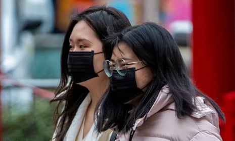 Members of the Chinese community in Manchester wearing face masks. The incidents in Hampshire have led people to fear wearing masks.
