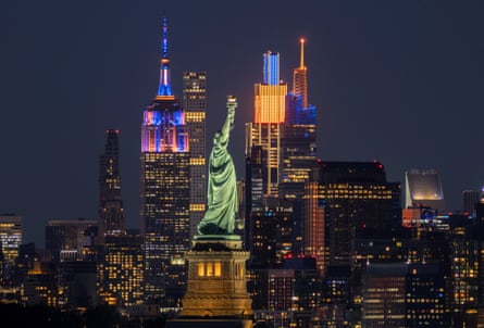 The Empire State Building is lit in the colours of the New York Knicks on Saturday night