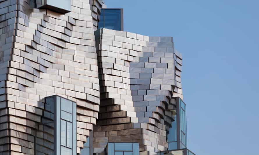 Gehry’s twisting geometric structure is finished with 11,000 stainless steel panels