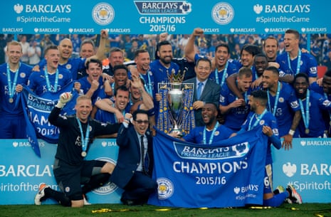 Leicester City’s owner Vichai Srivaddhanaprabha (holding the trophy) ands his son, Aiyawatt Srivaddhanaprabha (next to Kasper Schmeichel) join in the celebrations.