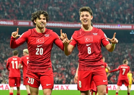 Ferdi Kadioglu and Arda Guler celebrate after combing for Turkey's goal