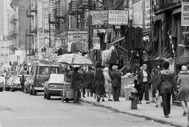 People walk on a crowded city street