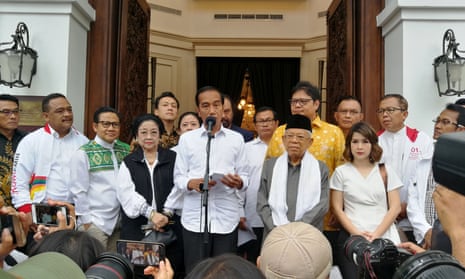 Joko Widodo talks to media during a press briefing in Jakarta