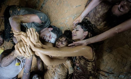 Protesters covered in mud outside Vale headquarters in Rio de Janeiro