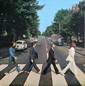 The Beatles - Abbey Road 1969Photo: Iain Macmillan Design: John KoshPhotographer Iain Macmillan only had a short time to get this shot on his Hasselblad camera. A policeman halted the traffic as Macmillan climbed up a stepladder in the middle of the road. The group crossed the road back and forth three times as Macmillan took six shots. Paul McCartney looked at the contact sheet and it was decided that frame five was the best.