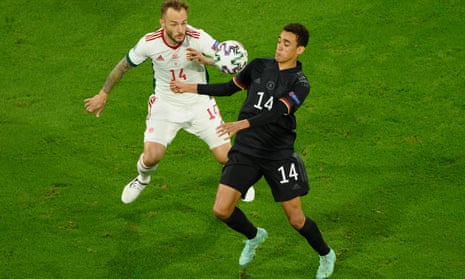 Jamal Musiala, right, who holds British and German passports, fights off a challenge from Gergo Lovrenscics during Germany’s Euro 2020 game against Hungary. 