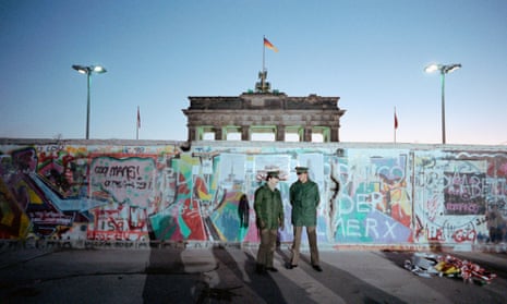 Border guards at the Berlin Wall in 1989.