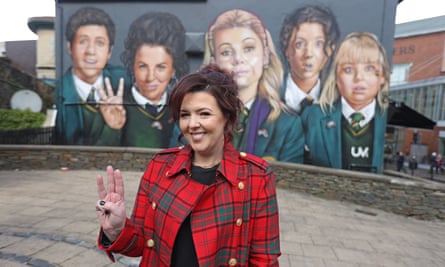 Lisa McGee in front of a Derry Girls mural in Derry