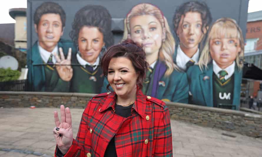 Lisa McGee in front of a Derry Girls mural in Londonderry on 7 April 2022.