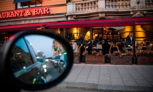 Diners at a restaurant in Stockholm on Friday.