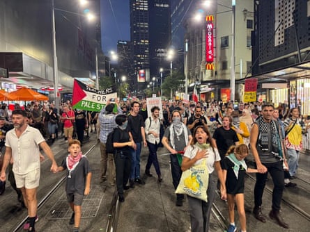 A splinter group from the Sydney Town Hall protest marches down George Street to Central station