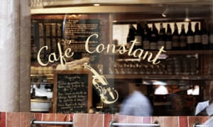 Close up of the window looking in to Le CafÃ© Constant, Paris.