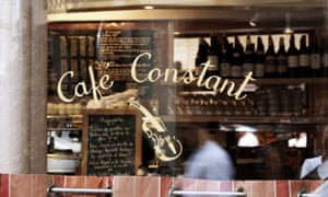 Close up of the window looking in to Le Café Constant, Paris.