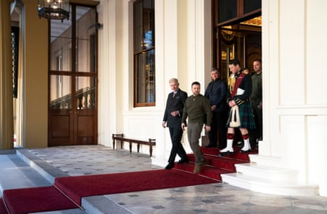 Ukrainian President Volodymyr Zelenskiy (2nd L) arrives for an audience with King Charles III at Buckingham Palace.