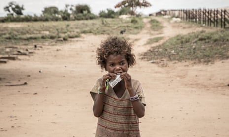 A girl eats a food supplement in Ifotaka, southern Madagascar, in December 2018.