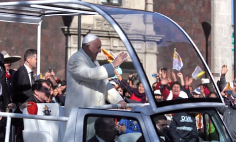 Pope Francis waves from the popemobile on his way to the National Palace in Mexico City on Saturday.
