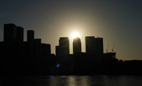 The sun over Canary Wharf, London.