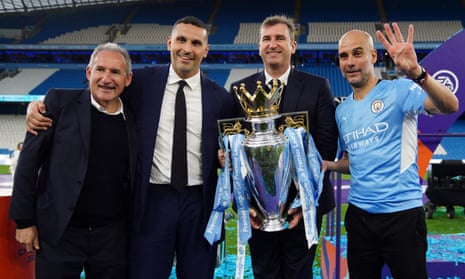 Manchester City manager Pep Guardiola with the Premier League trophy alongside chairman Khaldoon Al Mubarak, chief executive Ferran Soriano and football director Txiki Begiristain.