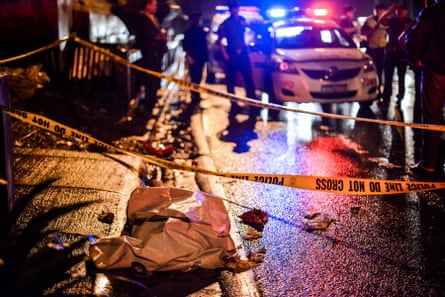 The body of a suspected drug dealer lies in a Manila street, the victim of a vigilante-style execution.