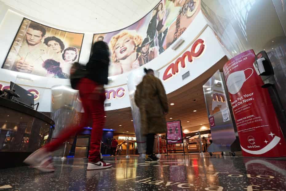 Movie patrons arrive to see a film in Burbank on 15 March.